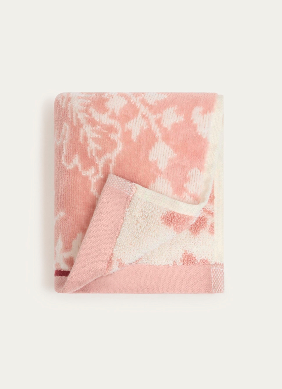 SERVIETTE INVITÉ JADE à GRANDS MOTIFS FLORAUX ROSE CLAIR