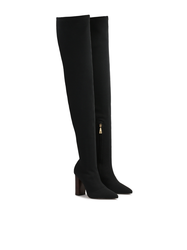 Over-the-knee boots made of fabric on a high post
