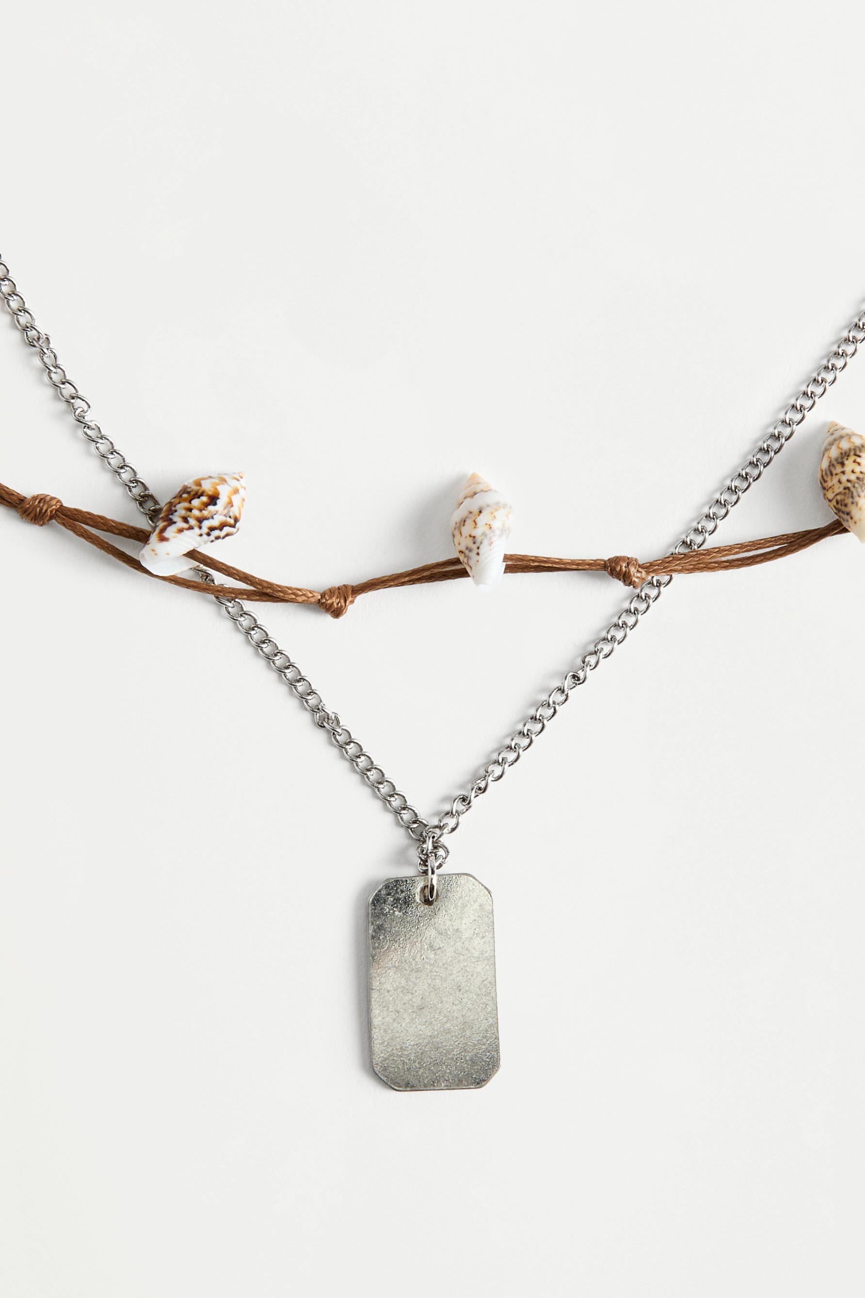 Collar doble conchas colgante