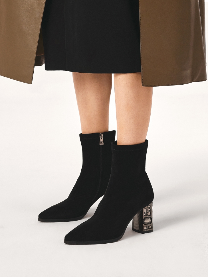 Stretch fabric boots with an embellished heel