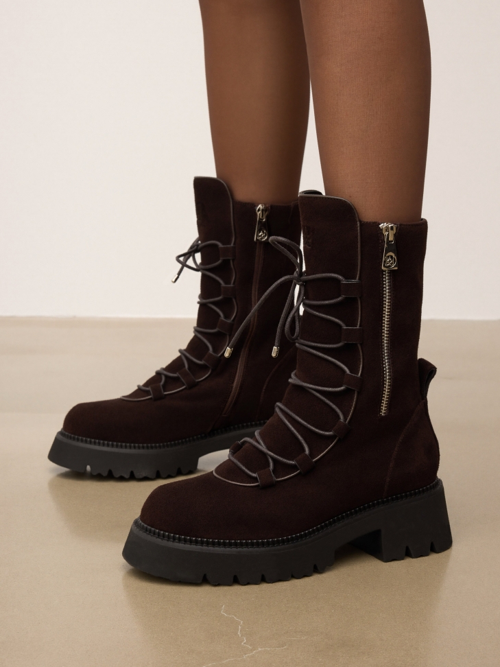 Zippered boots with decorative lacing