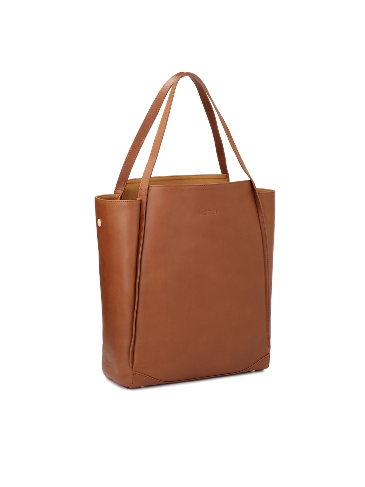Capacious leather handbag in minimal style