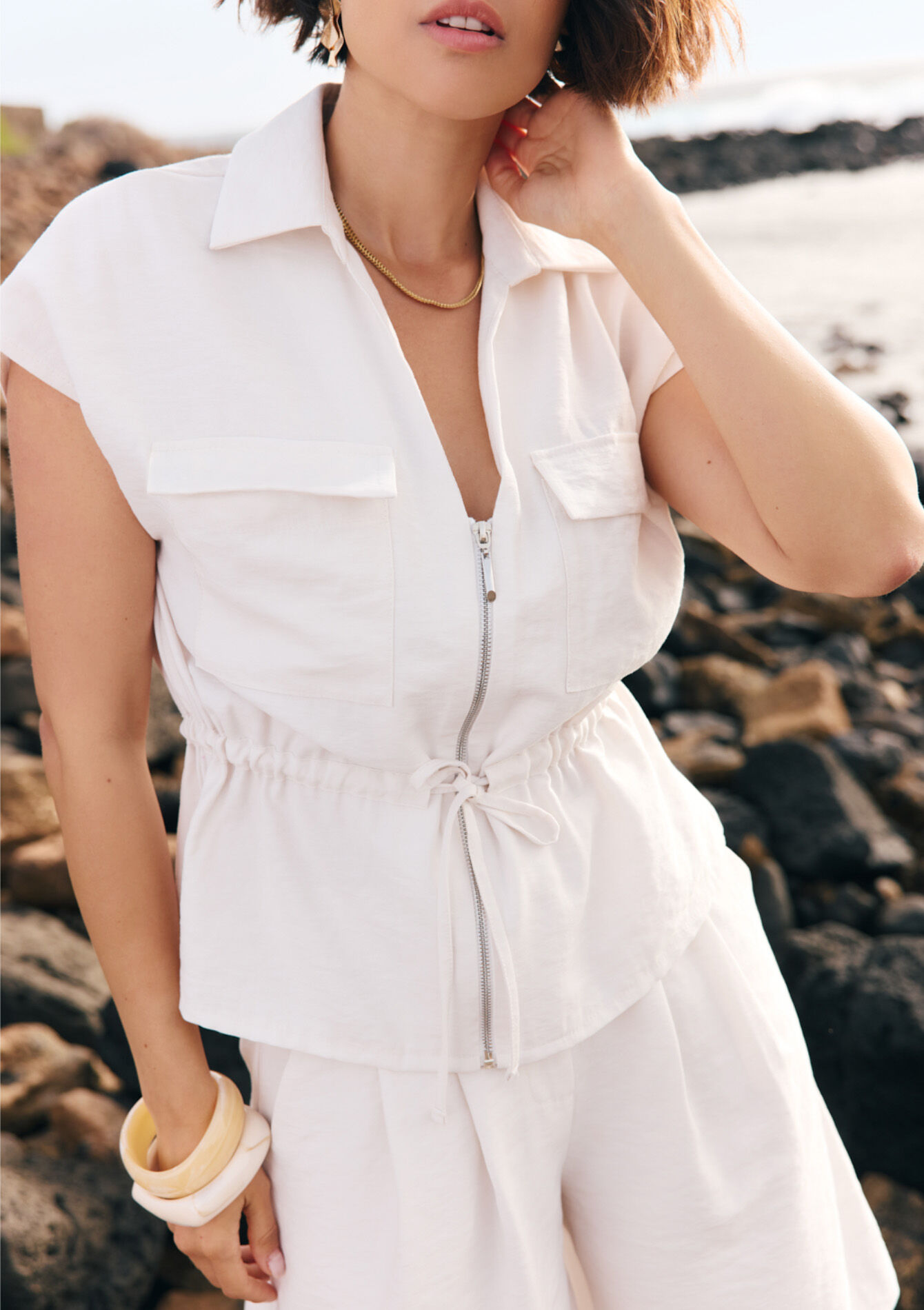 Mouwloze jas met rits