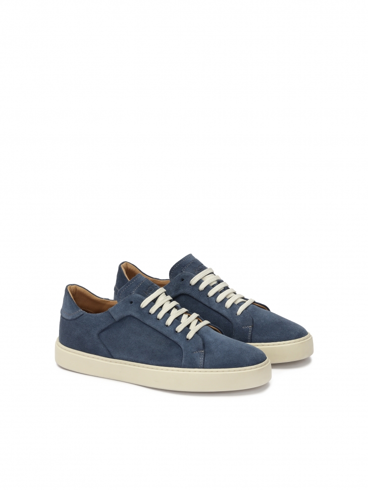 Navy blue sneakers on a white sole