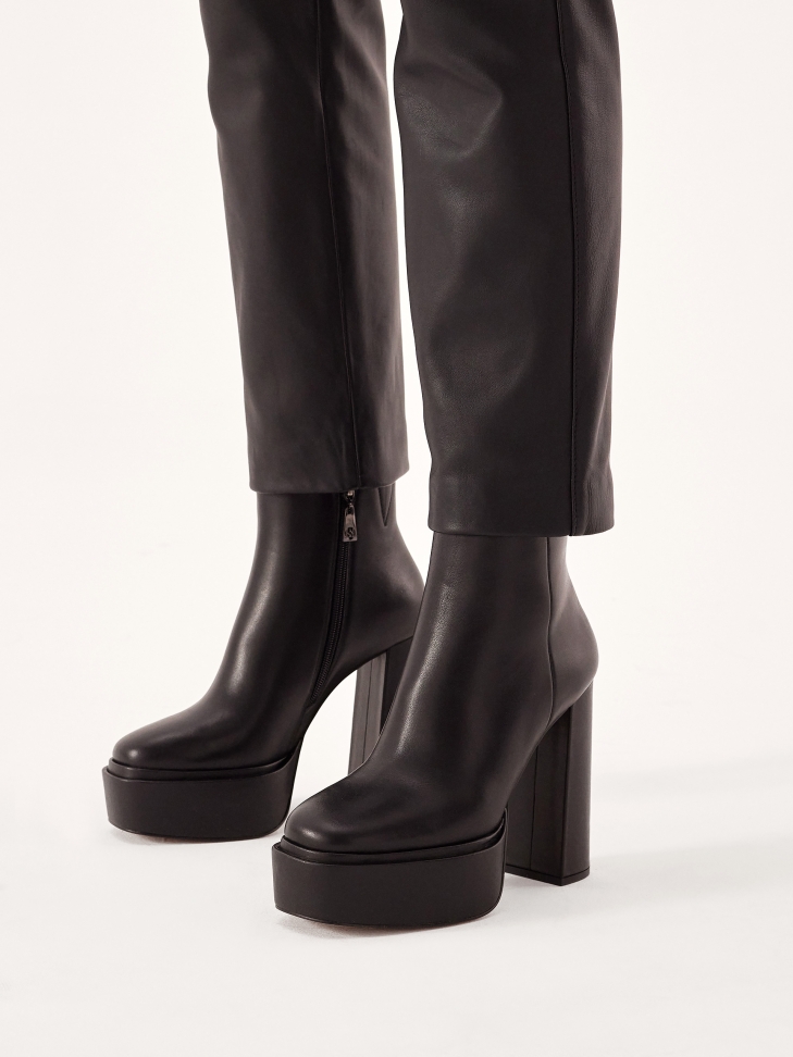 Black leather boots with high platform and heel