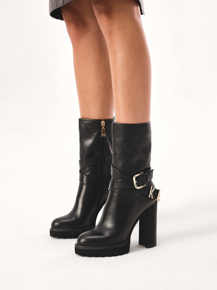 Stiletto booties with a logoed strap around the upper