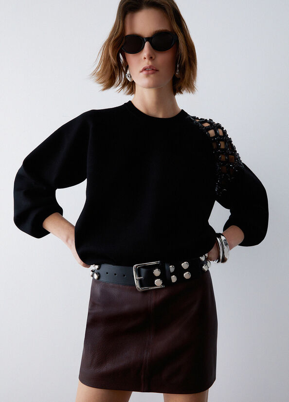 Cintura bustier con borchie