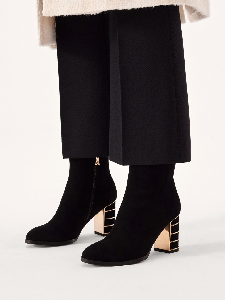 Suede boots with decorated heel