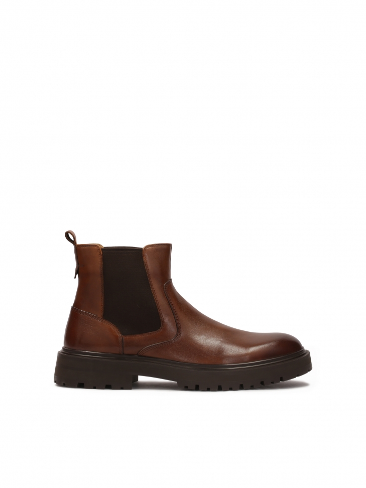 Brown Chelsea boots on a trefoil sole