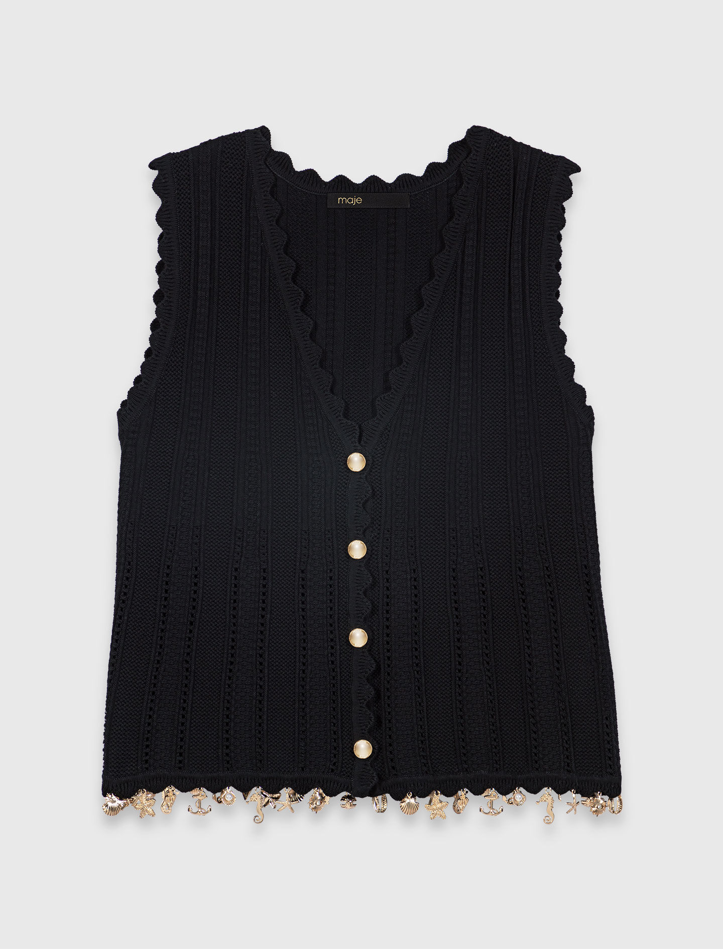 Gilet en maille avec bijoux dorés