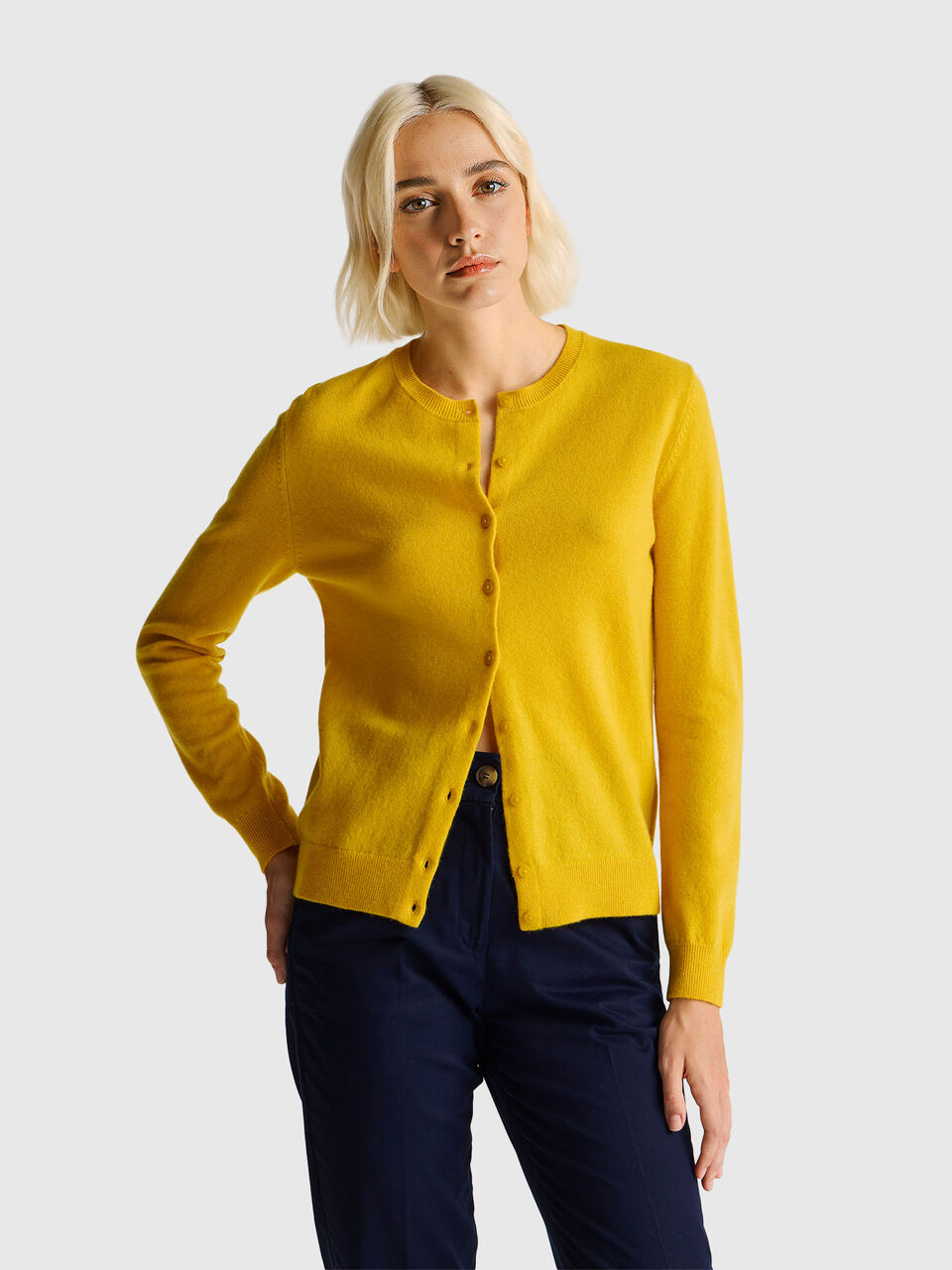Ocher yellow crew neck cardigan in pure Merino wool