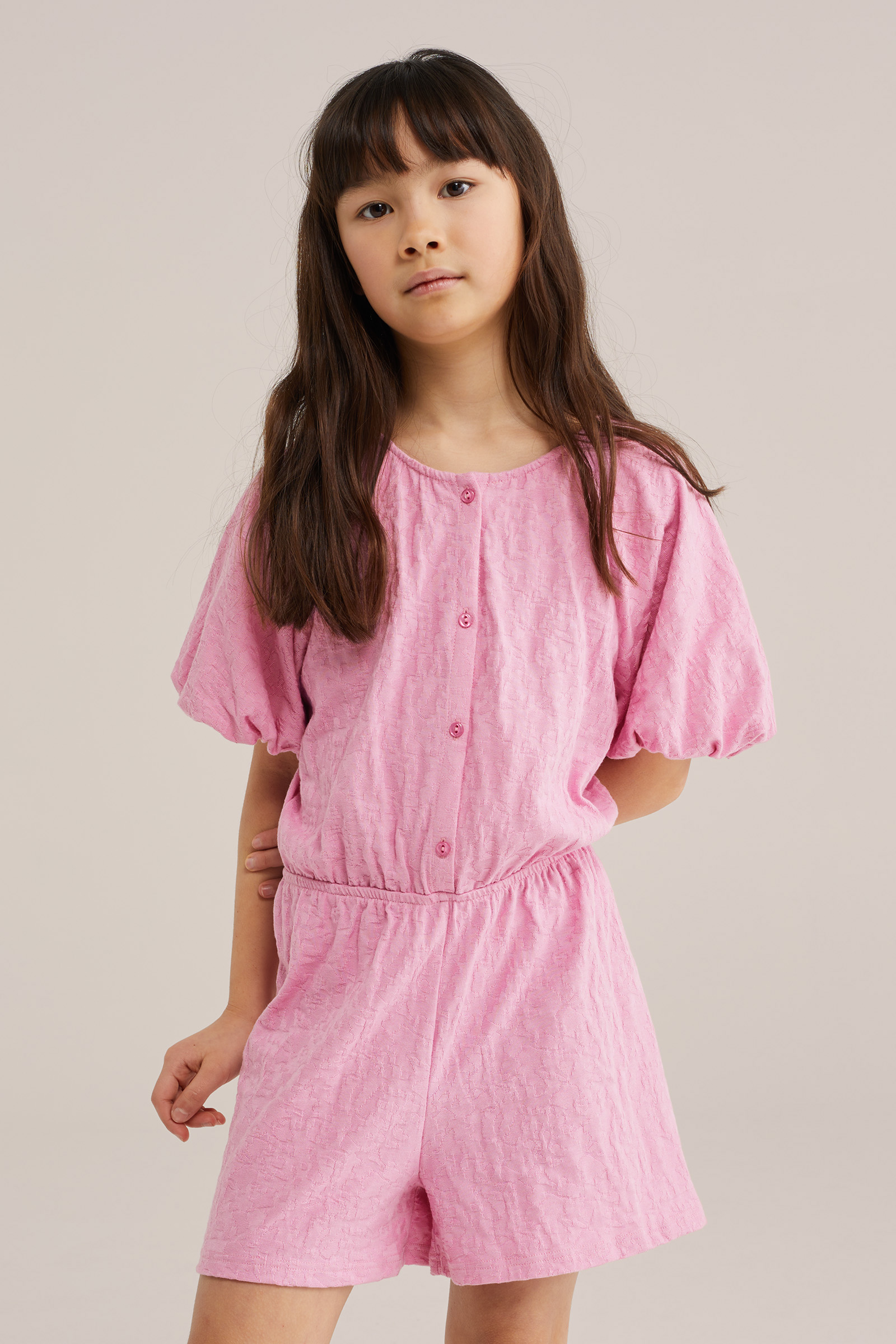 Meisjes jersey playsuit met structuur en ballonmouwen
