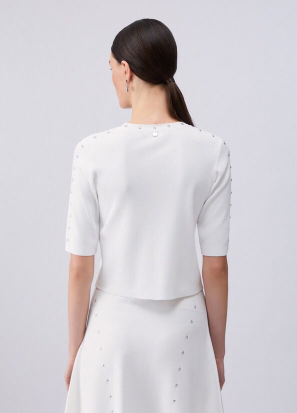 Top in maglia con borchie