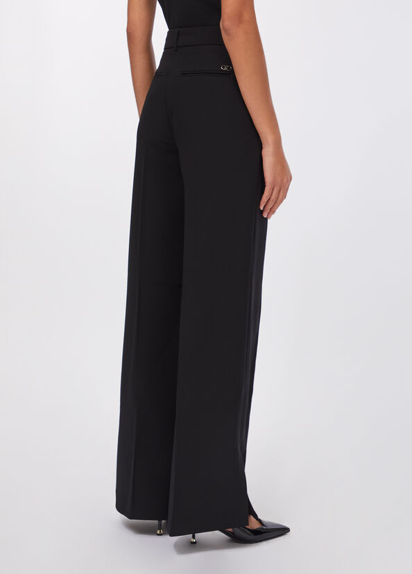 Pantaloni flare con spacchetti