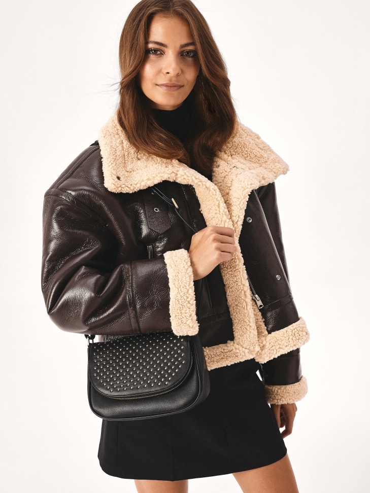 Leather shoulder bag with decorative flap