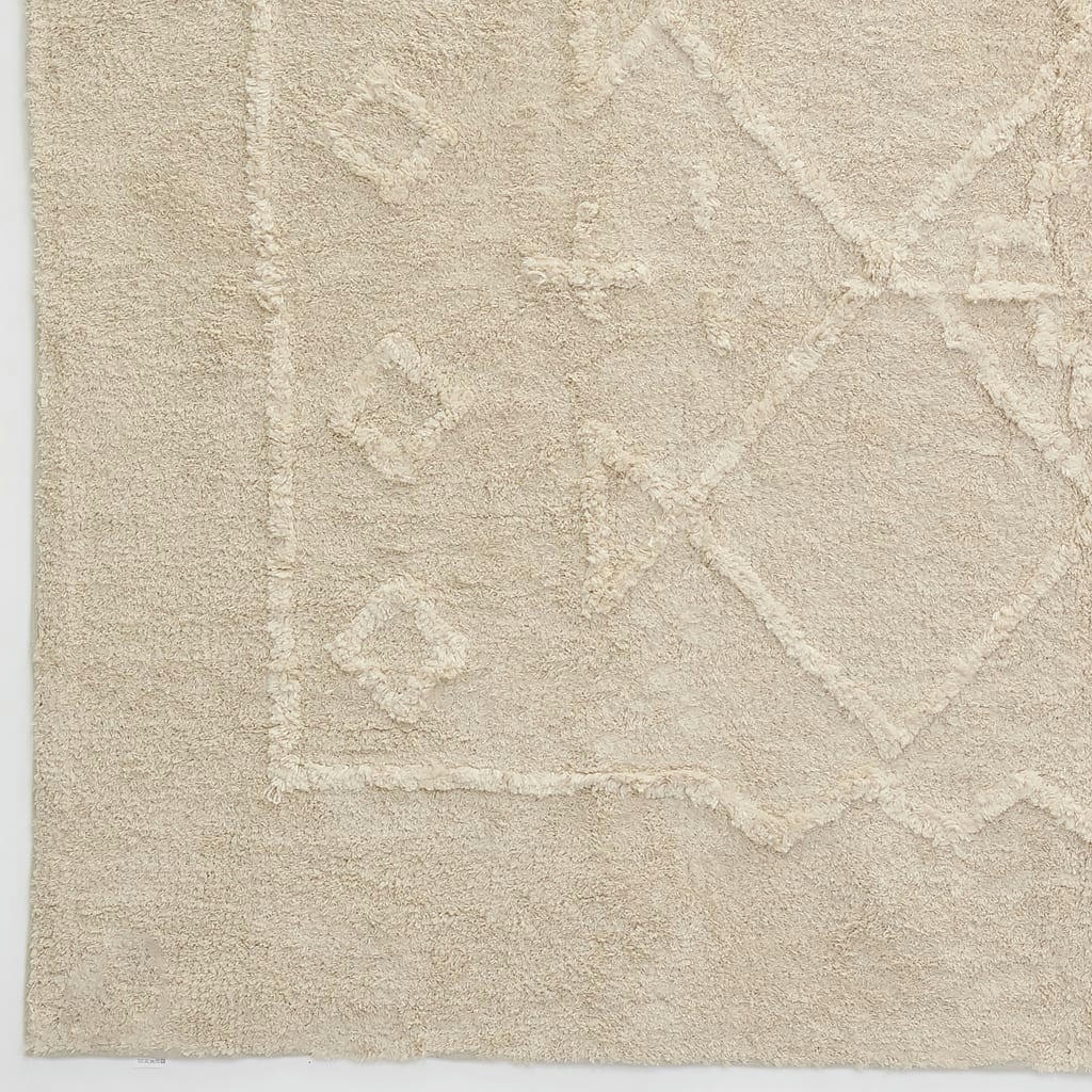 - Tapis en coton tufté écru motifs ethniques 140 x 200 cm