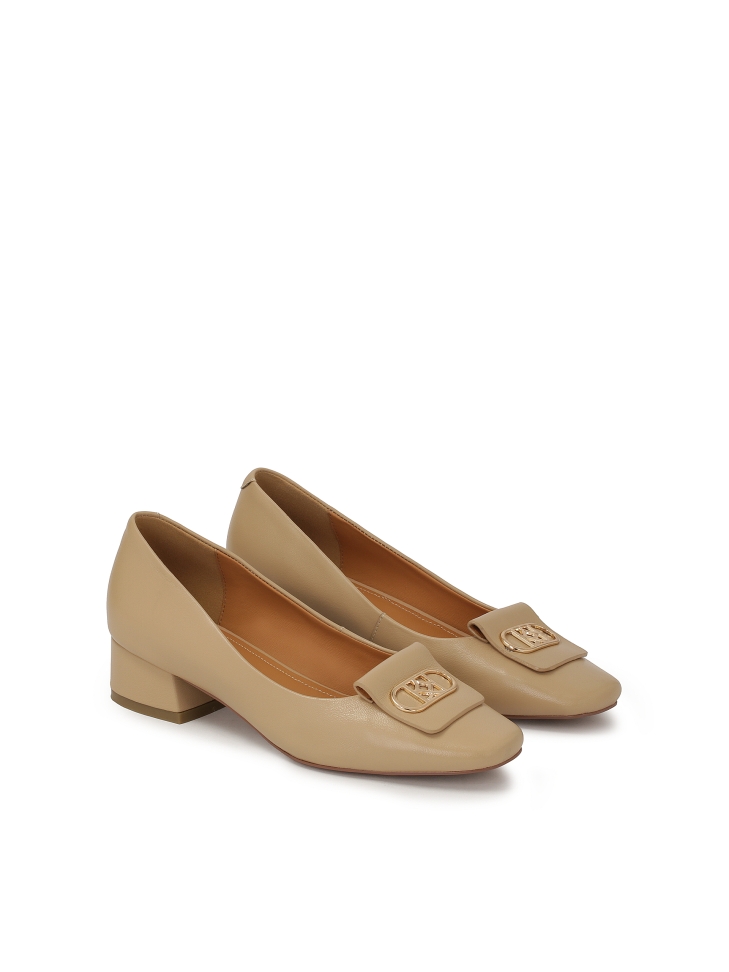 Classic beige pumps with jewelry embellishment