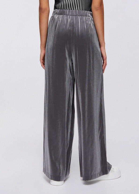 Pantaloni flare laminati