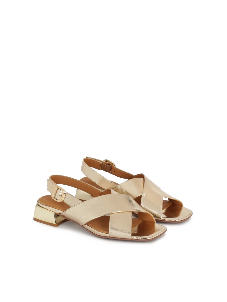 Low sandals in metalized gold leather