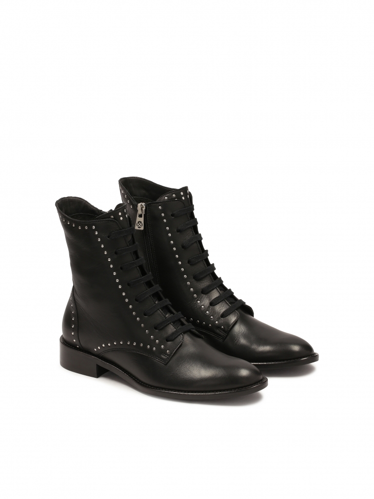 Black boots decorated with rivets