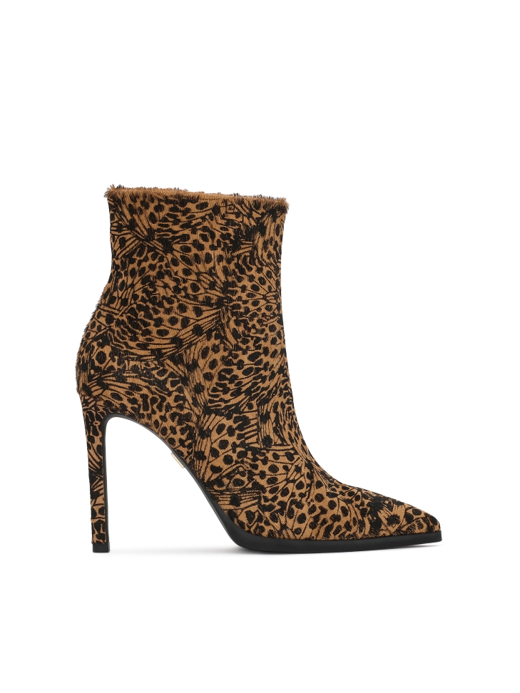 Patterned leather boots with natural hair finish