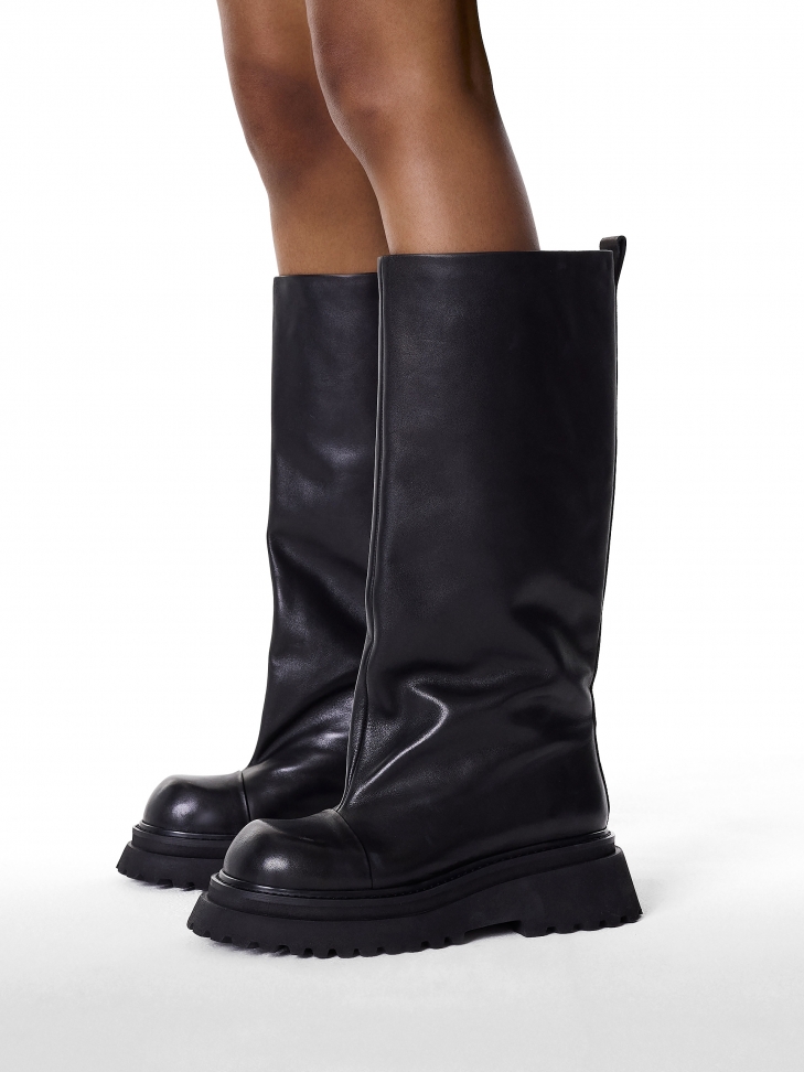 Black boots on a thick sole with a wide upper