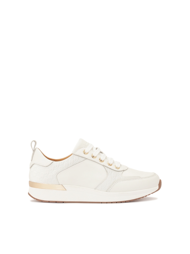 White sneakers decorated with KAZAR monograms
