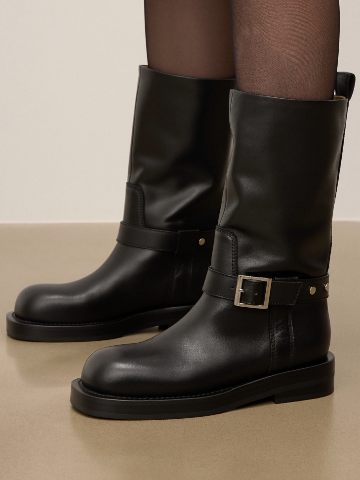 Black leather biker boots with decorative strap
