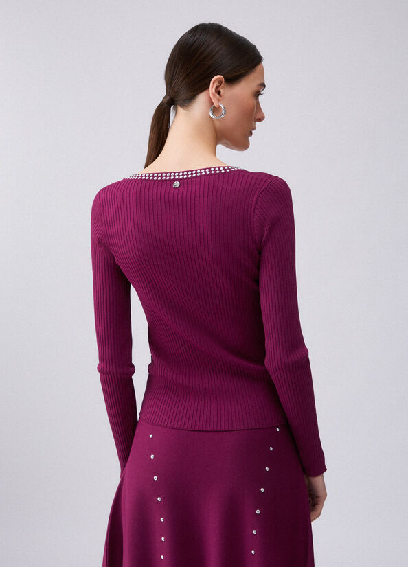 Maglia scollo a V con borchie