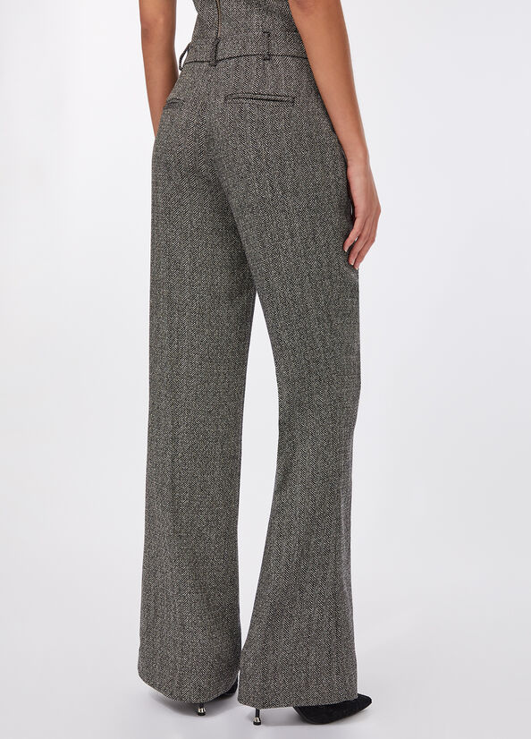 Pantaloni flare spinati