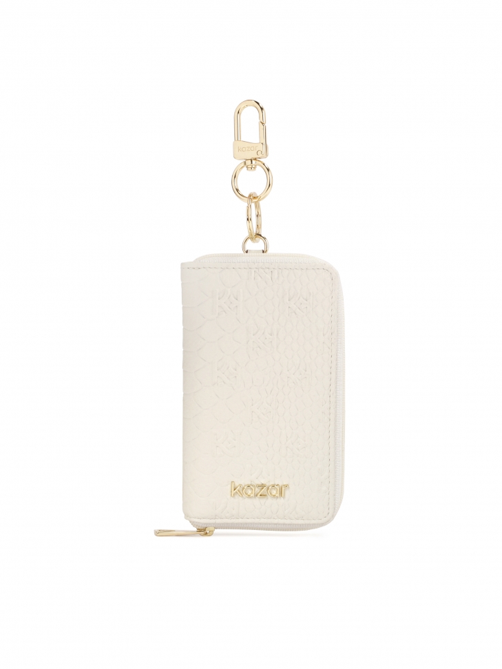 White leather card case with embossed motif