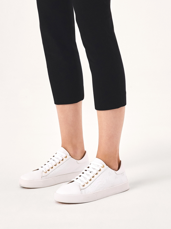 White sneakers with embossed pattern