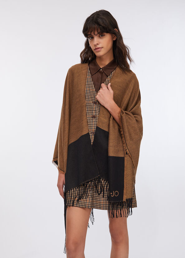 Poncho con logo e frange