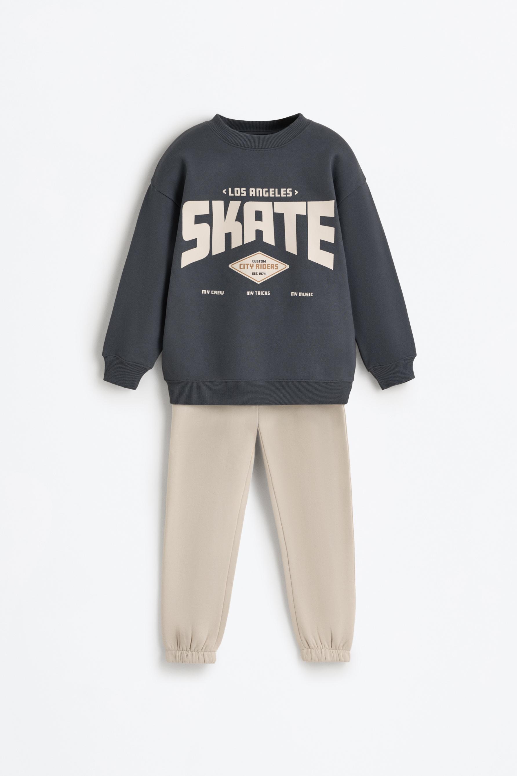 Conjunto sudadera estampada y pantalón felpa
