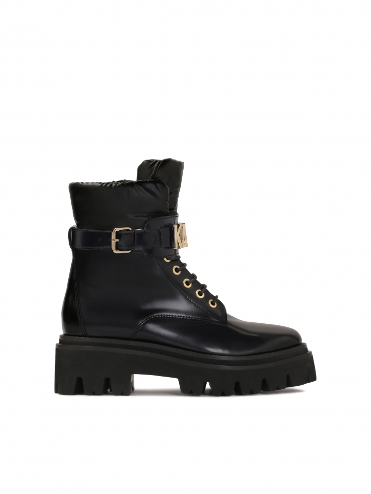 Ladies’ leather flat ankle boots with strap decorated with metal letters