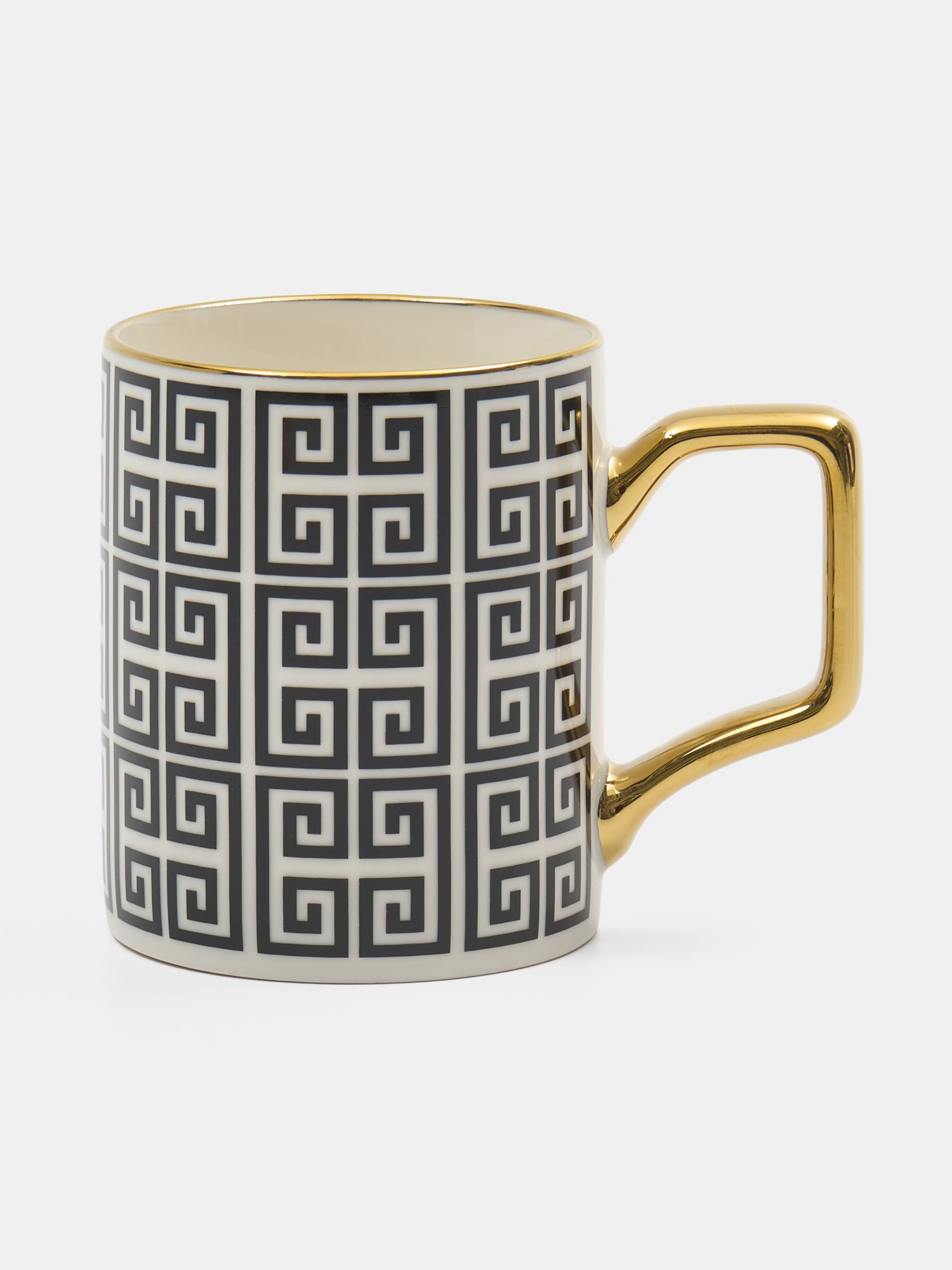Ceramiczny kubek z geometrycznym wzorem i złotym uchem
