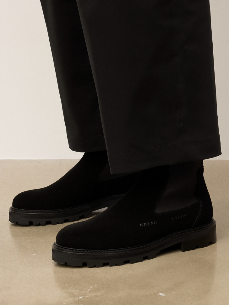 Black men's suede Chelsea boots with a solid sole