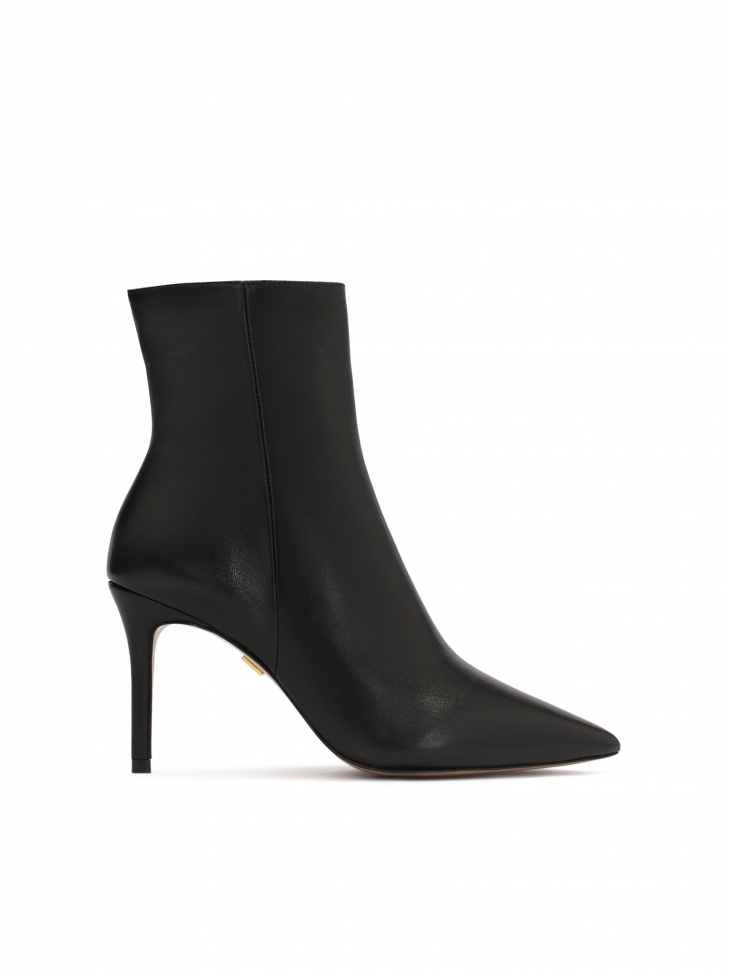 Minimalistic black booties with pointy toes
