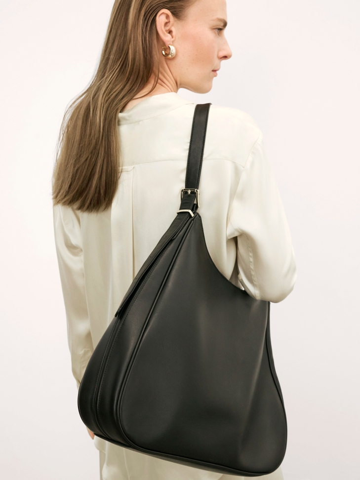 Elegant black leather handbag with trapezoidal shape