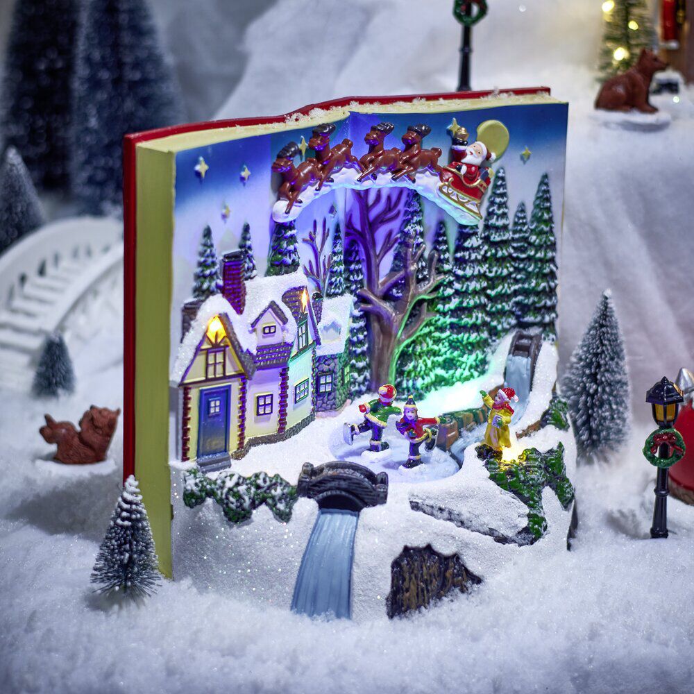 Village animé lumineux sonore façon livre ouvert avec enfants patinoire H20,5cm