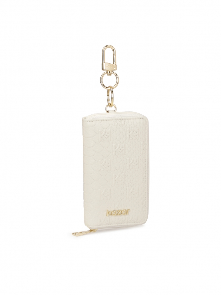 White leather card case with embossed motif