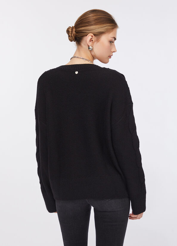 Maglione in lana a trecce