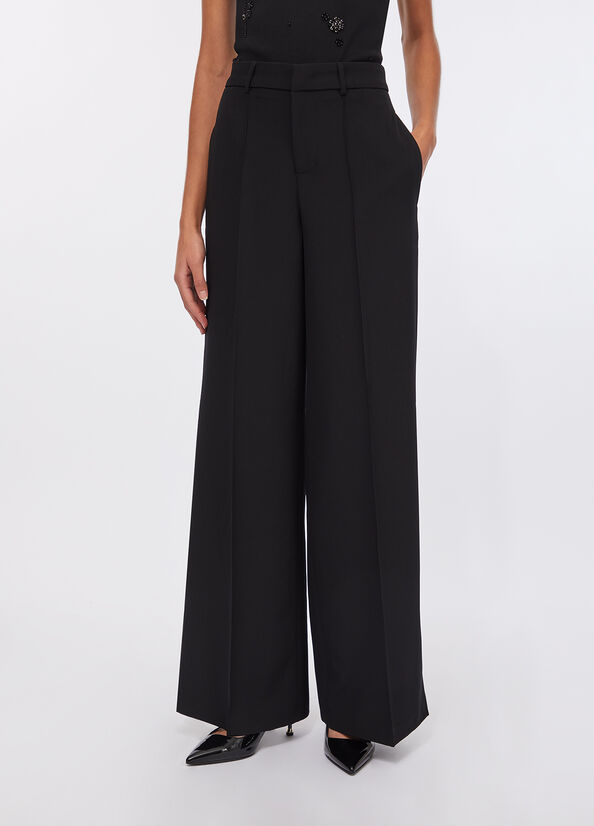 Pantaloni flare con spacchetti