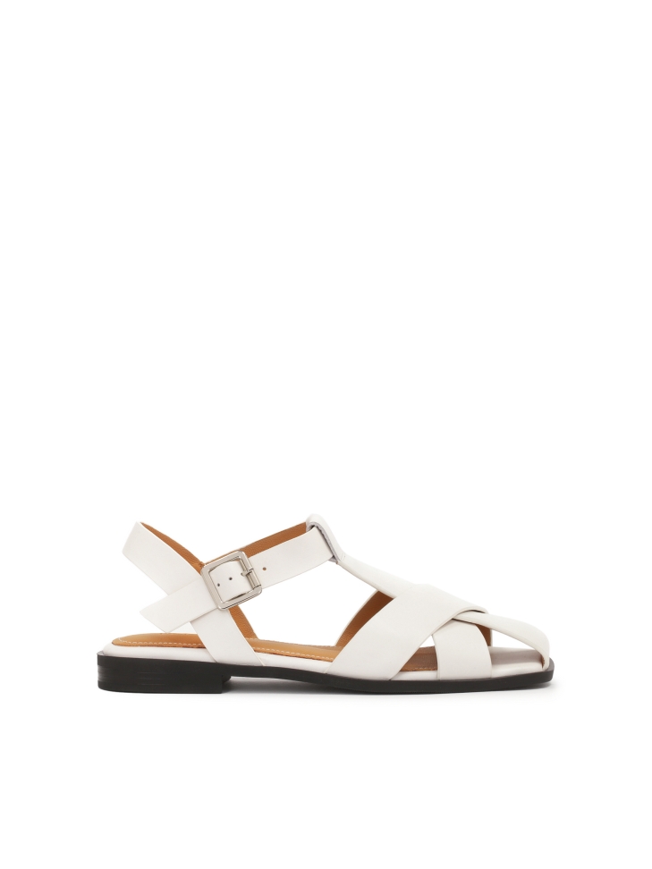 White sandals with a strap overshadowing the toes