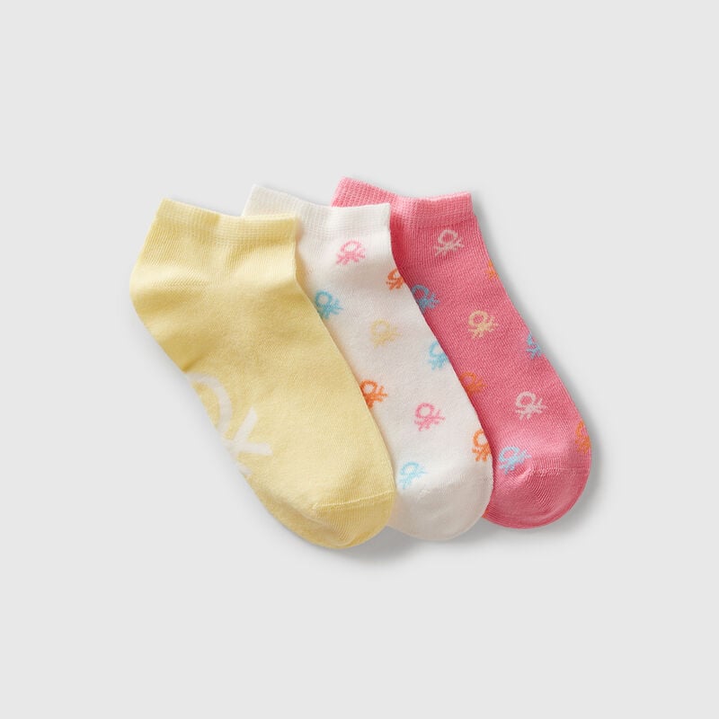 Three pairs of socks with logos