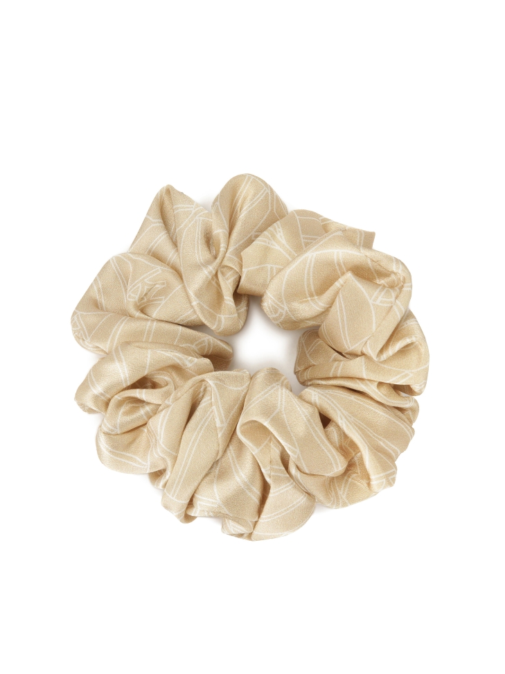 Beige scrunchie rubber band in a corporate pattern