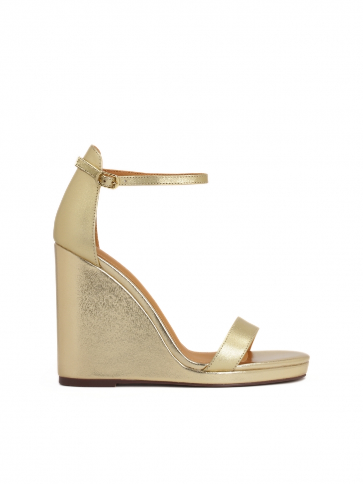 Gold leather sandals on a platform heel