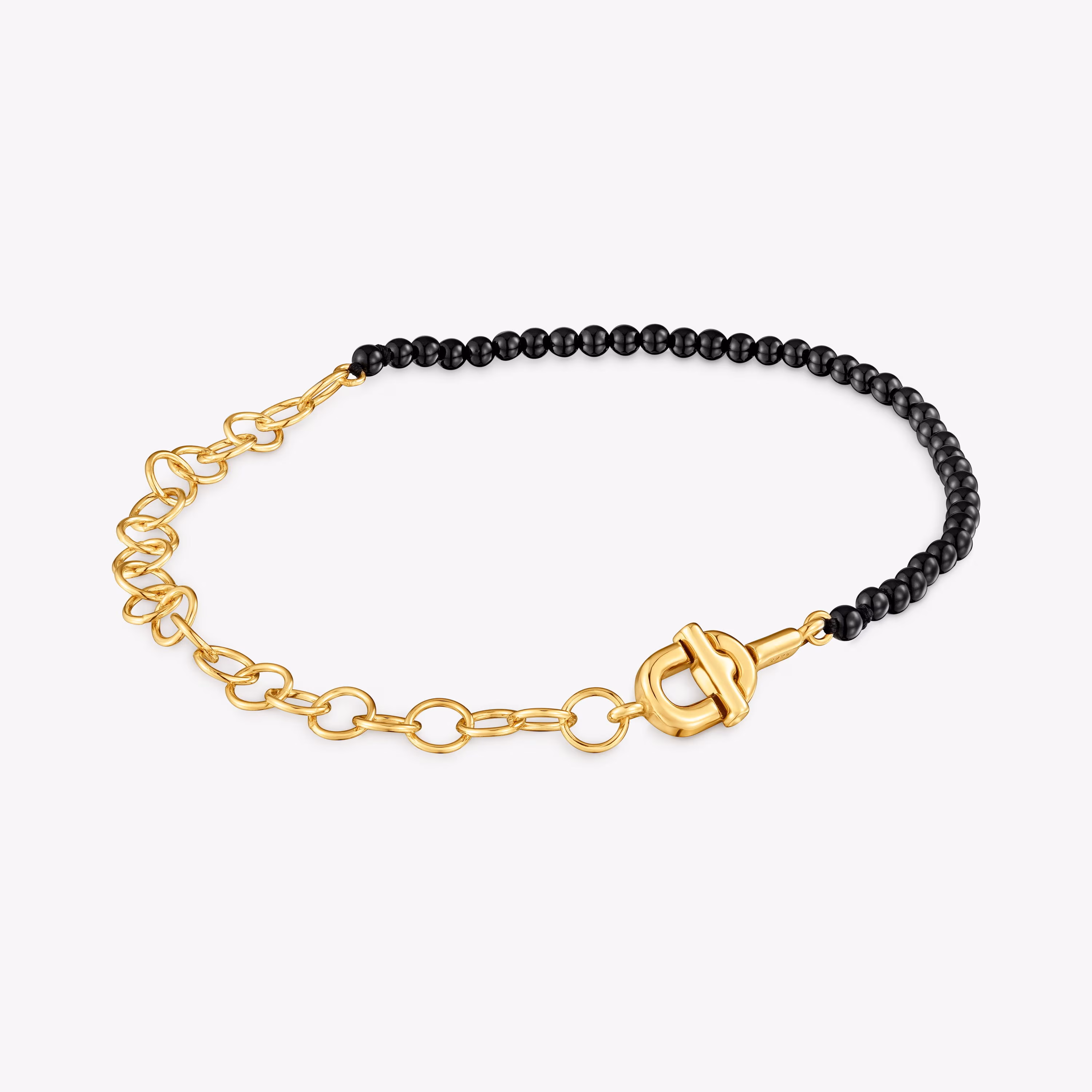 Pulsera cadena con baño de oro 18 kt sobre plata y ónix TOUS MANIFESTO