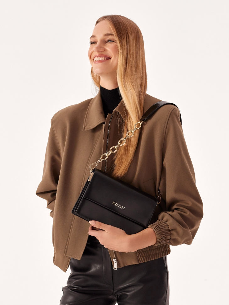 Small leather handbag with rigid construction