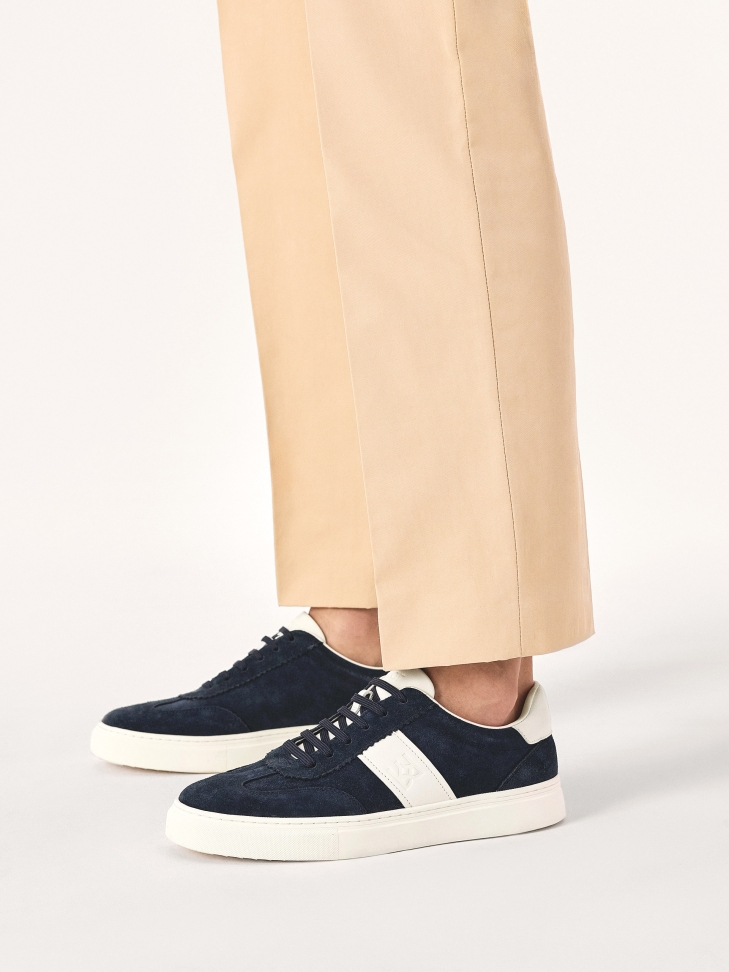 Navy blue and white suede sneakers